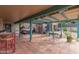 Inviting patio with pergola, hanging chairs, and outdoor seating area at 508 N Sierra Vista Dr, Wickenburg, AZ 85390