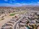 Stunning aerial view of a desert community, golf course, and mountain views at 6579 S Classic Way, Gilbert, AZ 85298