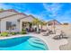 Gorgeous backyard with a sparkling pool and a covered outdoor dining area at 6579 S Classic Way, Gilbert, AZ 85298