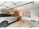 Garage featuring an epoxy floor, ample storage and a parked SUV at 7327 E Via Estrella Ave, Scottsdale, AZ 85258