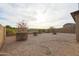 View of rockscaped backyard with mature landscaping at 7735 W Agora Ln, Phoenix, AZ 85043