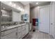Bathroom featuring double vanity, granite countertop, and glass enclosed shower at 7735 W Agora Ln, Phoenix, AZ 85043