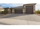 Well-maintained single-Gathering home with desert landscaping and a three-car garage at 7735 W Agora Ln, Phoenix, AZ 85043