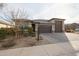 Charming single-Gathering home with a three-car garage and mature landscaping at 7735 W Agora Ln, Phoenix, AZ 85043