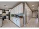 Well-equipped kitchen featuring ample counter space, stylish cabinetry, and modern appliances at 7735 W Agora Ln, Phoenix, AZ 85043