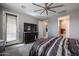 The main bedroom features a TV, ensuite bathroom and access to the backyard at 7735 W Agora Ln, Phoenix, AZ 85043