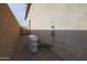 View of the air conditioning unit and side of the house at 7735 W Agora Ln, Phoenix, AZ 85043