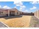 Spacious backyard with a covered patio, offering endless possibilities for recreation and relaxation at 8804 W Vista Ave, Glendale, AZ 85305