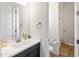 Bathroom featuring dark vanity, white counter tops, and natural light at 8804 W Vista Ave, Glendale, AZ 85305