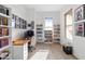 Inviting office space with bright walls, natural light, and shelving at 8804 W Vista Ave, Glendale, AZ 85305