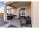 Relaxing covered patio with comfortable seating, perfect for outdoor entertaining and leisure at 8804 W Vista Ave, Glendale, AZ 85305