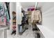 Walk-in closet with built-in shelves and rods for storage at 8804 W Vista Ave, Glendale, AZ 85305
