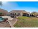 Picture of the backyard, includes a pool and hot tub with a covered patio and well-maintained yard at 9826 E Irwin Cir, Mesa, AZ 85209