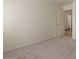 This bedroom features a neutral carpet, an entry door, and a walk-in closet at 9826 E Irwin Cir, Mesa, AZ 85209