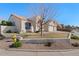 Charming home features a low-maintenance yard, tile roof, and a two-car garage at 9826 E Irwin Cir, Mesa, AZ 85209