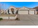 Charming single-story home with a three-car garage and well-maintained front yard at 9826 E Irwin Cir, Mesa, AZ 85209
