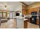 This bright kitchen has new appliances and a bar overlooking the living room at 9826 E Irwin Cir, Mesa, AZ 85209