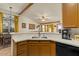 Modern kitchen with updated countertops, fixtures, and an open view to the Gathering room at 9826 E Irwin Cir, Mesa, AZ 85209