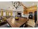 Spacious kitchen with black appliances and open to the living area at 9826 E Irwin Cir, Mesa, AZ 85209