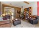 Open floor plan with a stone archway, bright tile flooring, and natural light at 9826 E Irwin Cir, Mesa, AZ 85209