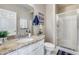 Bathroom featuring granite counters, single sink vanity, and a glass-enclosed shower at 10203 N 12Th Pl # 3, Phoenix, AZ 85020