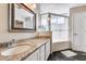 Bathroom featuring granite counters, single sink vanity, and a walk in shower at 10203 N 12Th Pl # 3, Phoenix, AZ 85020