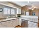A bright kitchen featuring stainless steel appliances, granite countertops, and a breakfast bar at 10203 N 12Th Pl # 3, Phoenix, AZ 85020