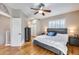 Spacious main bedroom with ceiling fan, hard wood floors, and large windows with blinds at 10203 N 12Th Pl # 3, Phoenix, AZ 85020
