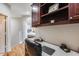 Well-lit office space with built-in shelving, perfect for working from home, bedroom in background at 10203 N 12Th Pl # 3, Phoenix, AZ 85020