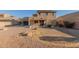 Spacious backyard with patio, desert landscaping, and block wall featuring home's exterior at 10318 E Irwin Ave, Mesa, AZ 85209