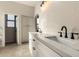 Stylish bathroom with double sinks, white marble countertops and cabinets at 10318 E Irwin Ave, Mesa, AZ 85209