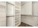 Walk-in closet with white shelving and hanging rods for optimal storage at 10318 E Irwin Ave, Mesa, AZ 85209