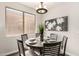 Dining room features a modern chandelier and stylish seating for a delightful eating experience at 10318 E Irwin Ave, Mesa, AZ 85209