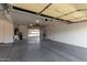 Spacious garage with concrete flooring, ample storage space, and a utility sink at 10318 E Irwin Ave, Mesa, AZ 85209