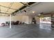 Spacious three car garage featuring high ceilings and ample storage space, offering practicality at 10318 E Irwin Ave, Mesa, AZ 85209
