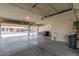 Bright three car garage, with lots of open space, featuring a sink, and an open garage door at 10318 E Irwin Ave, Mesa, AZ 85209