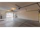 Spacious garage with concrete flooring, ample storage space, and access door at 10318 E Irwin Ave, Mesa, AZ 85209