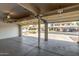 Open three-car garage showcasing the spacious interior, offering plenty of room for vehicles and storage at 10318 E Irwin Ave, Mesa, AZ 85209