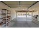 Inside a spacious three-car garage offering abundant room for storage and vehicle parking at 10318 E Irwin Ave, Mesa, AZ 85209
