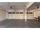 Spacious garage with concrete flooring, ample storage space, and tandem doors at 10318 E Irwin Ave, Mesa, AZ 85209