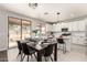 Open floor plan combines kitchen and dining areas with modern appliances and natural light at 10318 E Irwin Ave, Mesa, AZ 85209