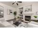 Bright living room features a fireplace, built-in shelves, and a cozy seating area at 10318 E Irwin Ave, Mesa, AZ 85209