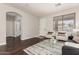 Bright living room features a plush rug, contemporary furniture, and abundant natural light at 10318 E Irwin Ave, Mesa, AZ 85209