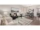 Inviting living room shows stylish decor, a comfortable sofa, and a glass coffee table at 10318 E Irwin Ave, Mesa, AZ 85209