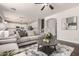 Spacious living room with staircase access and open view to kitchen at 10318 E Irwin Ave, Mesa, AZ 85209