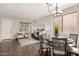 Open-concept living space features dining and living area with access to the front door at 10318 E Irwin Ave, Mesa, AZ 85209