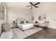Bright main bedroom showcasing hardwood floors, neutral decor, and comfortable seating at 10318 E Irwin Ave, Mesa, AZ 85209