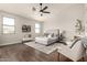 Spacious main bedroom with a ceiling fan, hardwood floors, and lots of natural light at 10318 E Irwin Ave, Mesa, AZ 85209