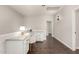 Office space with built in desk and shelves, wood-look floor, and neutral wall paint at 10318 E Irwin Ave, Mesa, AZ 85209