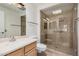 Bright bathroom featuring a glass shower and updated vanity with a sink at 10419 W Loma Blanca Dr, Sun City, AZ 85351